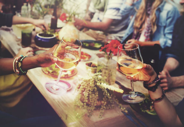 Group eating together around table