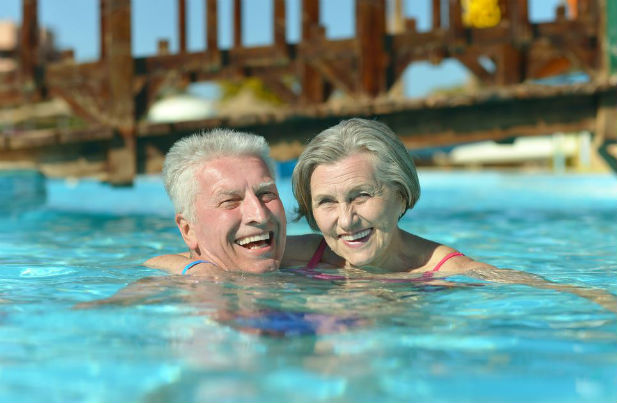 Couple in the pool swimming