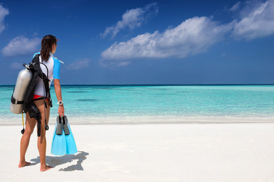 Woman in warm water scuba gear