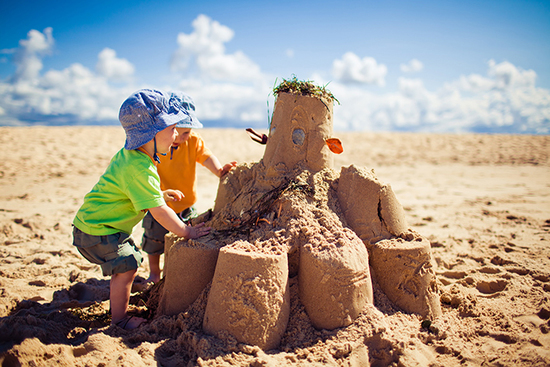 travel insurance cover kids playing on the beach
